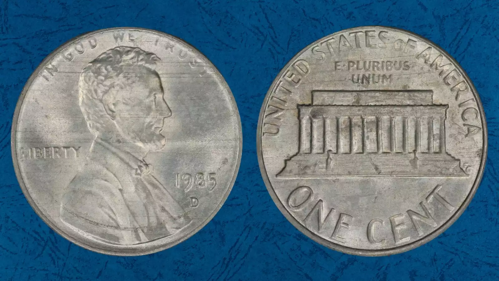 1985 penny partial plating error showing exposed gray zinc on Lincoln portrait